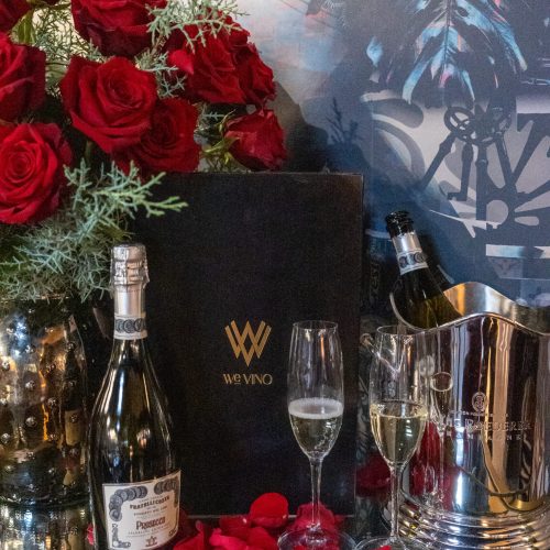 Romantic Valentine's Day dinner place setting with a red rose at WeVINO in Westlake Village.